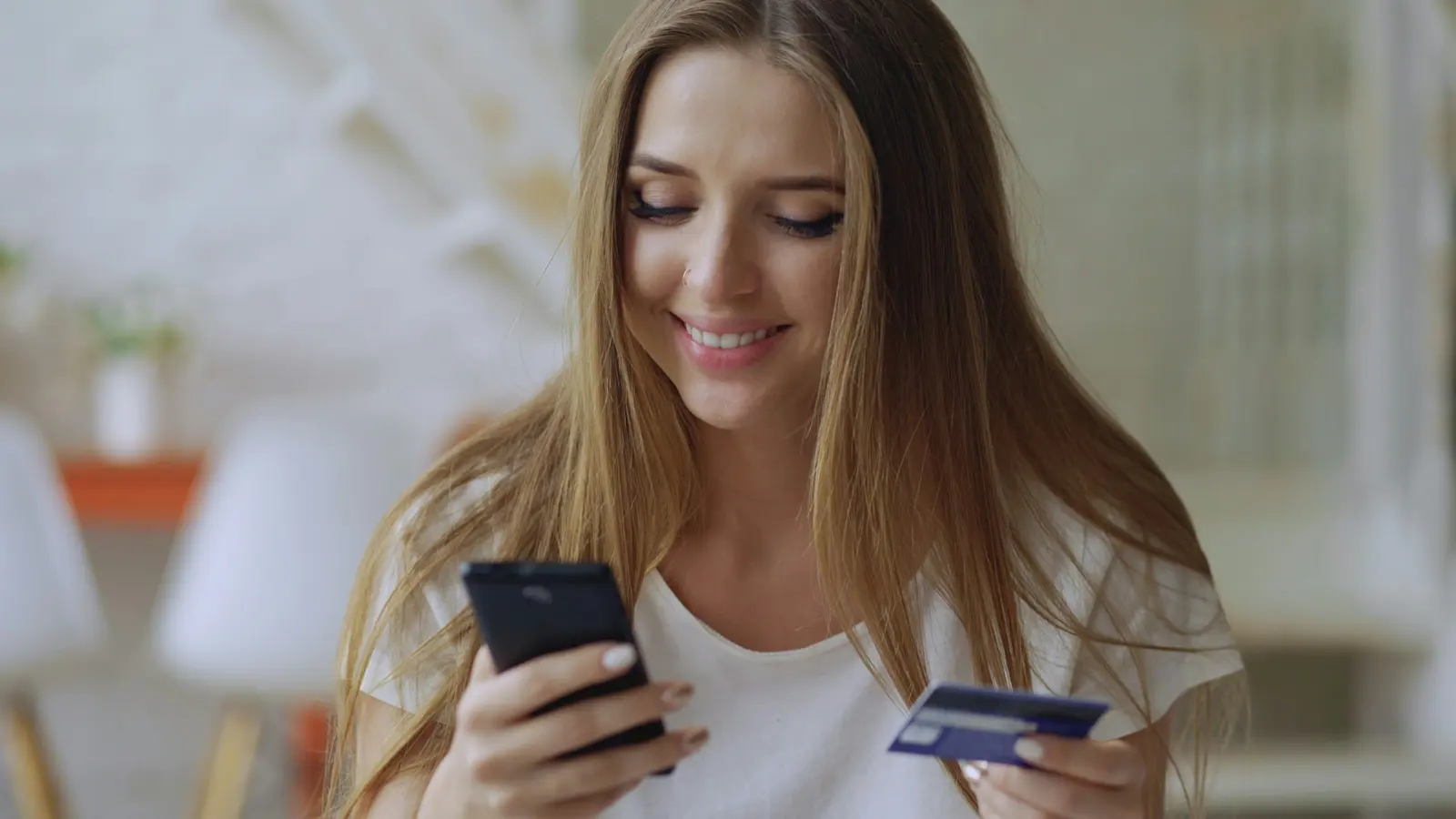 Shopper paying on her phone with a card