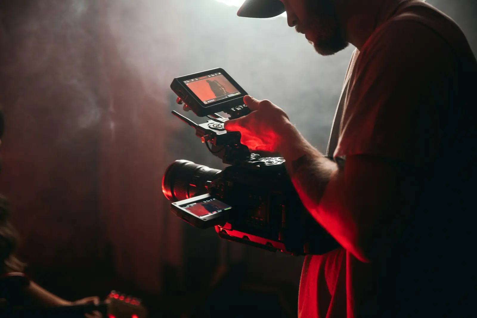 Videographer filming with a cinema camera